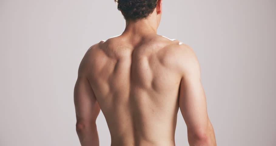 Studio, back and man flex muscle for growth, development and strength with power. Strong, shirtless person and bodybuilder with fitness progress, exercise and physique on white background space