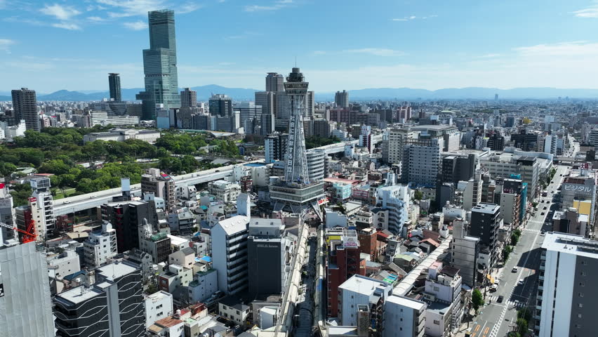 Tsutenkaku Tower In Shinsekai District, Osaka, Japan. - aerial forward shot