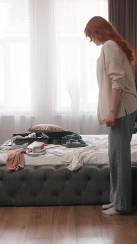Timelapse quickly rushing Caucasian woman cleaning home cloth sorting clothes female homeowner girl hurry in bedroom packing for travel trip mess in bedroom house walking indoors housework clean