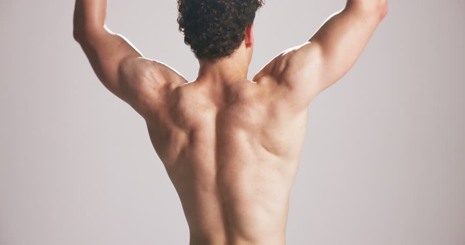 Studio, biceps and man flex muscle for growth, development and strength with power. Strong back, shirtless person and bodybuilder with fitness progress, exercise or physique on white background space