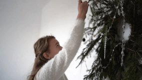 family with toddler and teenager decorates pine wreath, Christmas tree for home decor - Powered by Shutterstock - Get 15% off with code: PIKWIZARD15