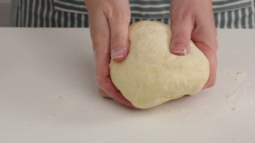 Pâte brisée making dough with butter by hands