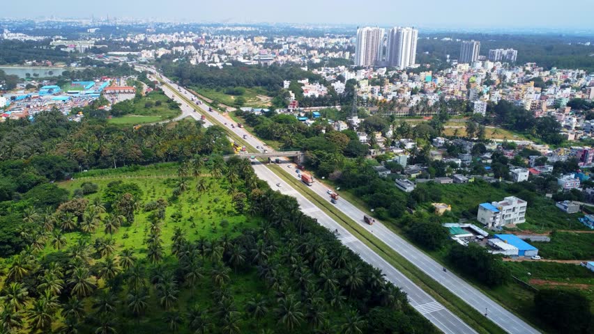 Ariel Shot of beautiful Bangalore City in India with nice road highway connecting Mysore passingby in Karnataka, India	