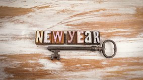 Words New Year made from colorful vintage wooden letterpress blocks with antique metal key on rustic wooden background. New beginnings goals and opportunities
 - Powered by Shutterstock - Get 15% off with code: PIKWIZARD15