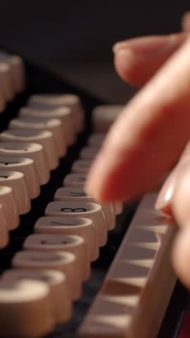 Hands typing on a vintage typewriter capture the essence of creativity and nostalgia in a quiet setting, beautifully highlighting the art of writing.