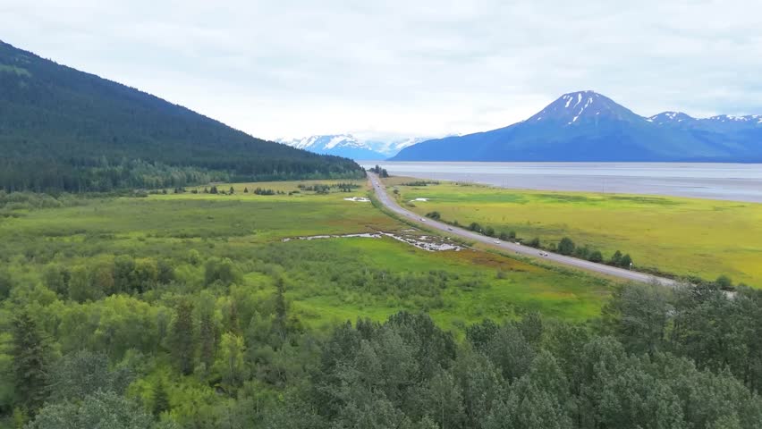 Aerial Road View Through Green Valley and Mountains – Scenic Landscape Drone Footage	
