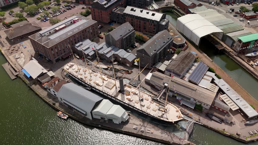 Bristol England: 28th July 2025: Drone view of Brunel's SS Great Britain rests at the dock in Bristol Harbourside, surrounded by historic buildings along the River Avon