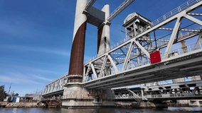 Close view of a bridges structural elements and support columns over the river industrial architecture with metal trusses and concrete piers under clear sky, Kaliningrad, Russia - Powered by Shutterstock - Get 15% off with code: PIKWIZARD15