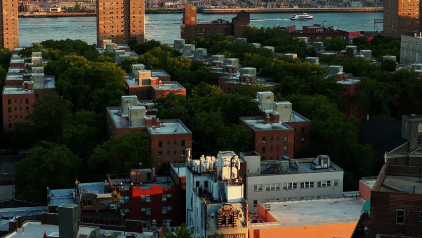 Aerial View of Manhattan's Lower West Side at Sunset, Featuring Modern Architecture and the Hudson River