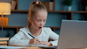 Caucasian little child daughter girl kid studying at home talking laptop video call emotional hands gesture writing homework talk study learn homework distant education communicate with online teacher - Powered by Shutterstock - Get 15% off with code: PIKWIZARD15