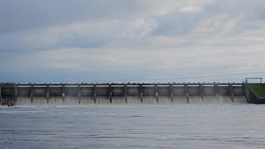 Close up shot of Hydroelectricity dam with all spillways partially opened after heavy rains raised Wisconsin Rive level
