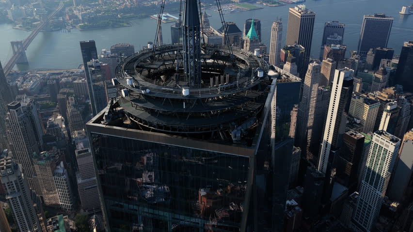 Aerial view over the One World Trade Center in New York City, showcasing the iconic skyscraper and the East River
