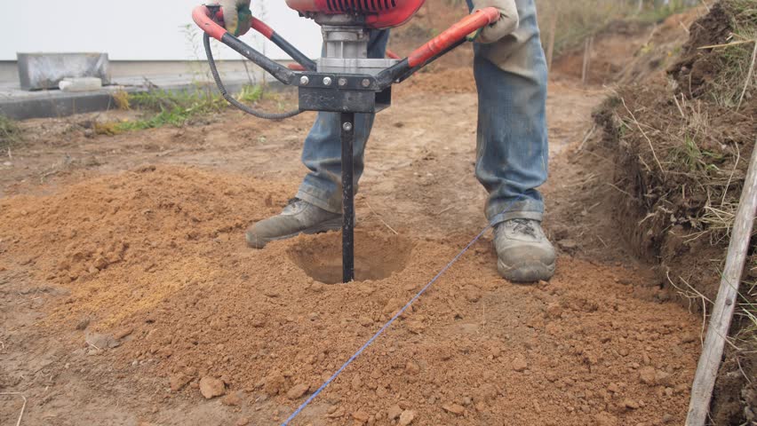 The man drills the ground with rig machine 4k