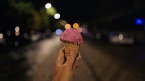 Contemplative pause with pink gelato, Reflective pavement captures quick urban pause with pink - Powered by Shutterstock - Get 15% off with code: PIKWIZARD15