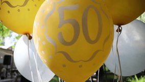 Bright yellow and white balloons with the number 50, symbolizing a festive anniversary or birthday celebration. Perfect for illustrating milestone events, party decorations, or cheerful holiday backgr - Powered by Shutterstock - Get 15% off with code: PIKWIZARD15