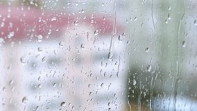 Raindrops falling on windowpane. A view of day time in the city with raindrops falling on the glass - Powered by Shutterstock - Get 15% off with code: PIKWIZARD15