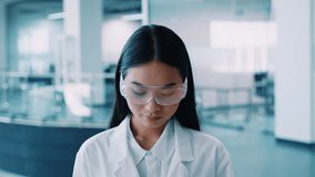 Scientist in laboratory gear conducts research during pandemic - Powered by Shutterstock - Get 15% off with code: PIKWIZARD15