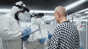 Doctor in isolation examines patient under biohazard conditions, recording treatment outcomes and immune response to support innovation and medical science in epidemic prevention. Camera B. - Powered by Shutterstock - Get 15% off with code: PIKWIZARD15