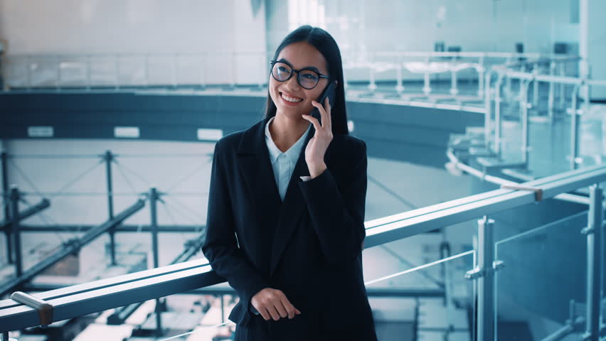 Professional woman in modern office making a business call