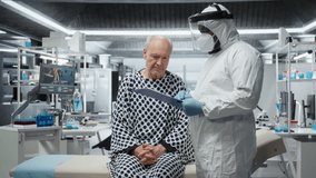 Doctor in hazmat suit administers medical care to a contagious patient, recording health data and testing vaccine responses in a laboratory to develop effective antiviral antibiotics. Camera A. - Powered by Shutterstock - Get 15% off with code: PIKWIZARD15
