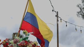 Video of the Ecuadorian national flag waving gracefully in the wind against a clear sky. A patriotic and symbolic scene representing national pride and identity. - Powered by Shutterstock - Get 15% off with code: PIKWIZARD15
