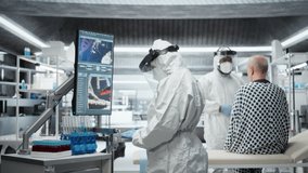 Medic in protective gear collecting data on infection spread, observing symptoms of patient in isolation and quarantine. Analyzing antibiotics and antiviral therapy for disease control. Camera A. - Powered by Shutterstock - Get 15% off with code: PIKWIZARD15