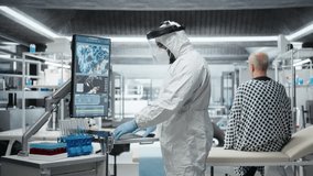 Black expert studying infectious virus molecules on tv screen, monitoring sick patient and checking his vitals. Working in laboratory to prevent biohazard and global disaster. Camera A. - Powered by Shutterstock - Get 15% off with code: PIKWIZARD15