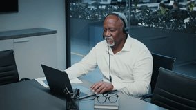 Mature African American businessman collaborates in a modern office setting - Powered by Shutterstock - Get 15% off with code: PIKWIZARD15