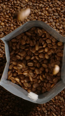 Slow Morning Coffee Ritual - Falling Roasted Beans in Cinematic Motion. Vertical shot.
