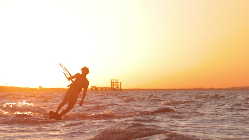Extreme kitesurfer gliding in tropical paradise sunset sea creating inspiring spray symbol of freedom happiness summer vibes lifestyle vacation travel destination exotic holiday commercial adventure