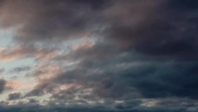 Blurred, out-of-focus, fuzzy dark rain clouds in the sky with gaps of evening setting sun, forming a gloomy stormy sky and covering the sky.  - Powered by Shutterstock - Get 15% off with code: PIKWIZARD15