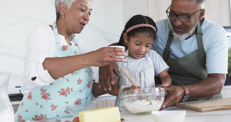 Grandparents guiding granddaughter pouring milk into bowl, code overlay glitching for culinary demo. Family, cooking, togetherness, warm, rustic, cheerful, educational