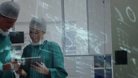 Surgeons reviewing data on tablet for planning surgery after overlay hand showing Solution piece. Medical, professionals, futuristic, collaboration, technology, innovation, healthcare - Powered by Shutterstock - Get 15% off with code: PIKWIZARD15