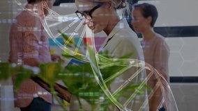 DNA helix shifting as scientist consulting tablet and colleague passing folder for biotech research. Innovation, collaboration, technology, teamwork, modern, workspace, data - Powered by Shutterstock - Get 15% off with code: PIKWIZARD15