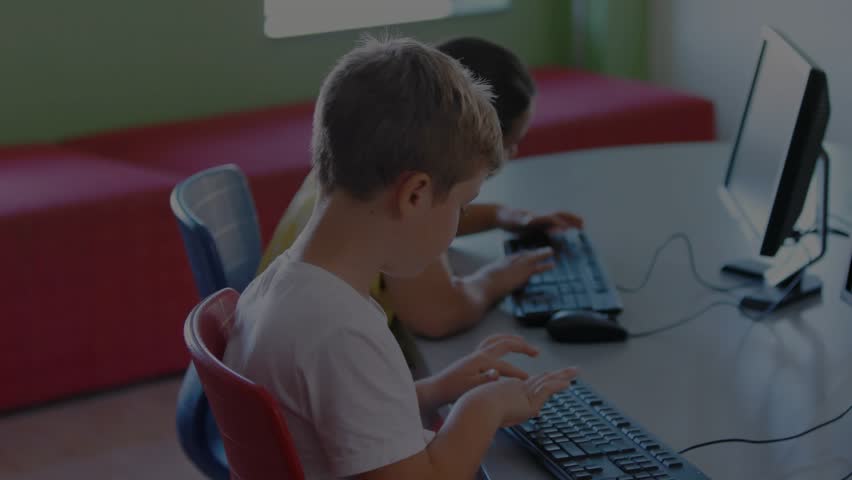 Classmates typing in computer lab, starting red overlay forming padlock highlighting data security. Technology, cybersecurity, education, digital, innovation, collaboration, focus - Powered by Shutterstock - Get 15% off with code: PIKWIZARD15