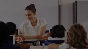 Female teacher guiding students on tablets in class, activating chart graphic illustrating progress. Education, technology, learning, classroom, innovation, communication, engagement - Powered by Shutterstock - Get 15% off with code: PIKWIZARD15