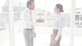 Two colleagues raising gesture in corporate office animating globe overlay sealing deal handshake. Collaboration, communication, teamwork, digital, modern, professional, innovation - Powered by Shutterstock - Get 15% off with code: PIKWIZARD15