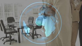 Corporate female executive extending arm into hologram globe showing reach with colleagues huddling. Collaboration, teamwork, innovation, digital, diversity, leadership, networking - Powered by Shutterstock - Get 15% off with code: PIKWIZARD15