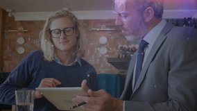 Two colleagues tapping tablet pointing stylus causing data overlays animating for business review. Collaboration, technology, innovation, professional, communication, analysis, interface - Powered by Shutterstock - Get 15% off with code: PIKWIZARD15