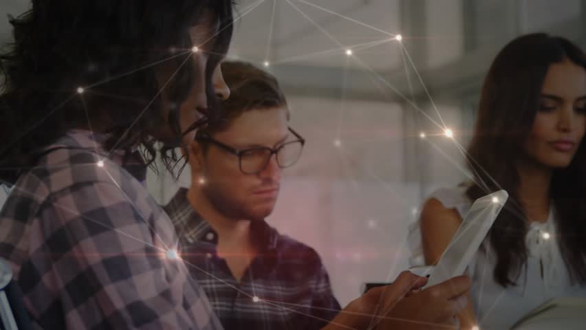 Coworkers scrolling smartphones and tablets in office sparking network overlay linking for teamwork. Collaboration, digital, connectivity, modern, workspace, innovation, communication - Powered by Shutterstock - Get 15% off with code: PIKWIZARD15