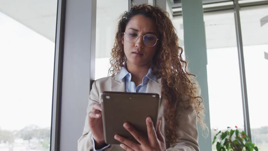 Woman tapping tablet screen creating user-profile network overlay growing over business office view. Futuristic, technology, innovation, digital, connectivity, professional, urban - Powered by Shutterstock - Get 15% off with code: PIKWIZARD15