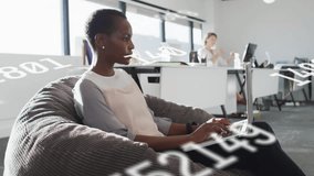 Woman sitting on beanbag, opening laptop initiating graphs for data insights and colleague on phone. Innovation, collaboration, technology, analytics, productivity, modern, workspace - Powered by Shutterstock - Get 15% off with code: PIKWIZARD15
