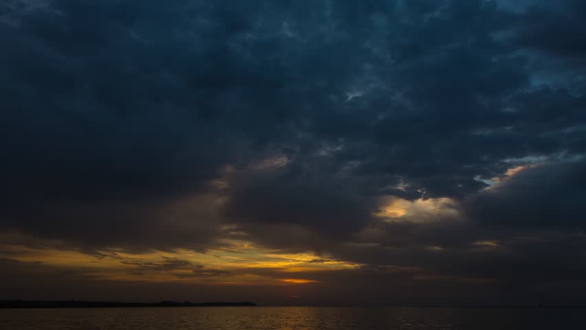Dramatic sunrise over the river with large clouds and clouds, time laps, 4k