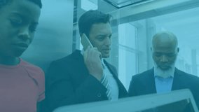 Mid adult man making phone call sparking floating social media metrics around professionals in lift. Corporate, teamwork, technology, communication, innovation, productivity, digital - Powered by Shutterstock - Get 15% off with code: PIKWIZARD15