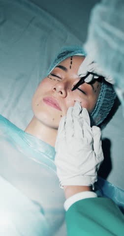 Woman, plastic surgery and drawing on face at hospital, hands and process for transformation. People, doctor and above of patient with facelift, lines or cosmetic procedure for aesthetic at clinic