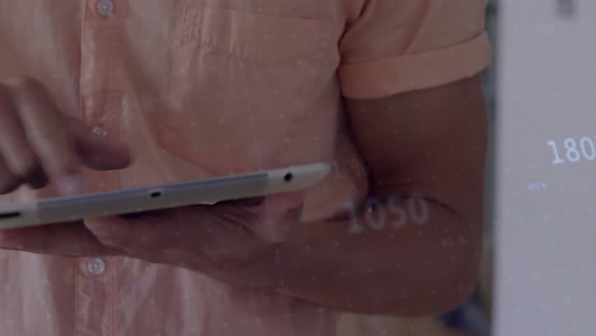 Man tapping tablet screen and dragging graph visualizing financial data then sending green spike. Analytics, data visualization, futurism, digital interface, professional, business, innovation - Powered by Shutterstock - Get 15% off with code: PIKWIZARD15