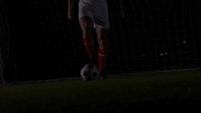 Soccer player tapping ball to keep control while sports analytics overlay filling under floodlights. Athletic, performance, digital, technology, competition, nighttime, intensity - Powered by Shutterstock - Get 15% off with code: PIKWIZARD15