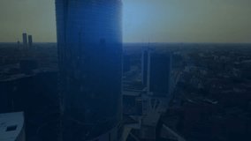 Drone panning glass-skyscraper activating circuit overlay icon enlarging Our Vision text pulsing. Futuristic, technology, innovation, digital, 都市, neon, connectivity - Powered by Shutterstock - Get 15% off with code: PIKWIZARD15