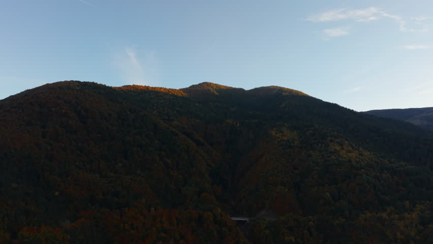 Sunset over Italian Alps with vibrant autumn foliage in tranquil scene