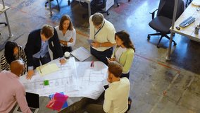Architecture team gathering around blueprint, sharing phone information and marking plans for phase. Collaboration, teamwork, project management, design, innovation, modern, professional - Powered by Shutterstock - Get 15% off with code: PIKWIZARD15